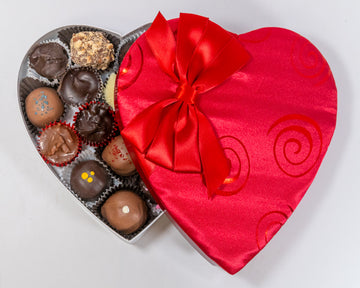 8 ounce red satin with sprial design heart shaped box of chocolates
