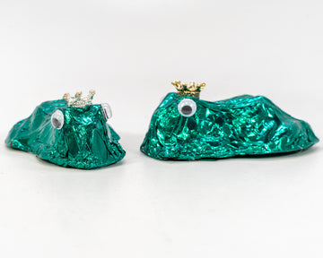 milk chocolate frog wrapped in green foil wearing a crown